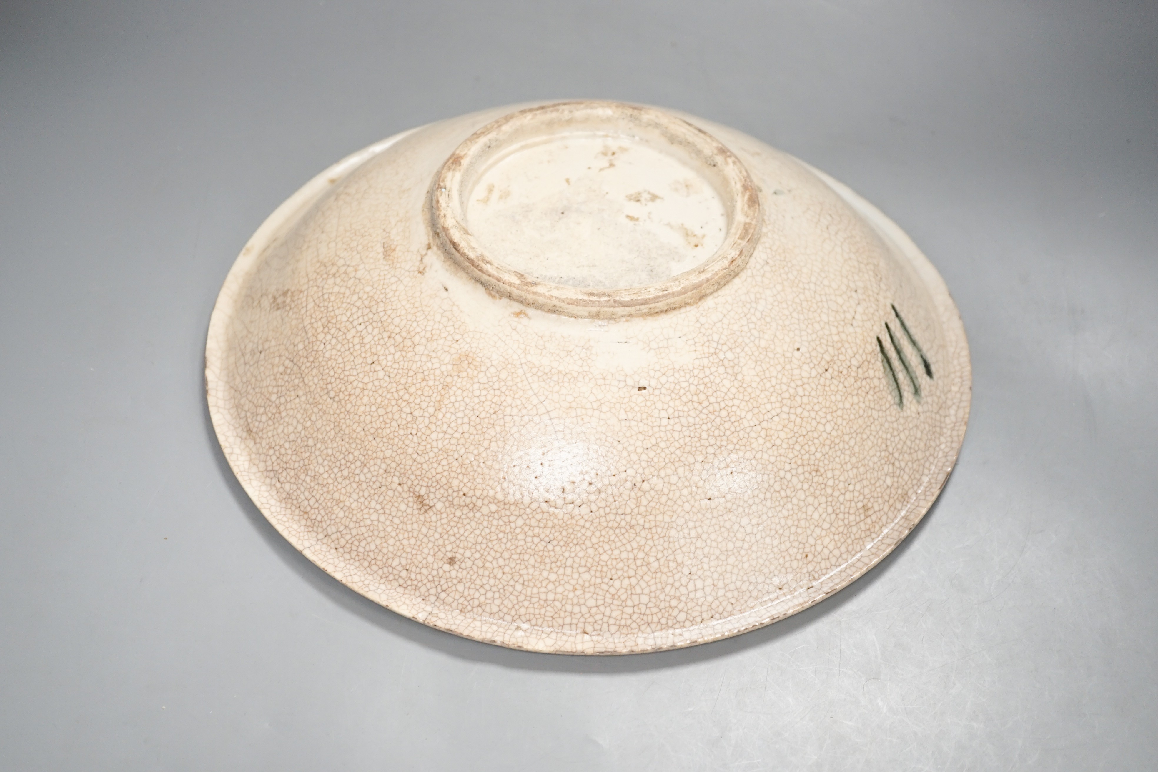 A Chinese provincial blue and white ‘kitchen Qing’ dish 32.5cm diameter